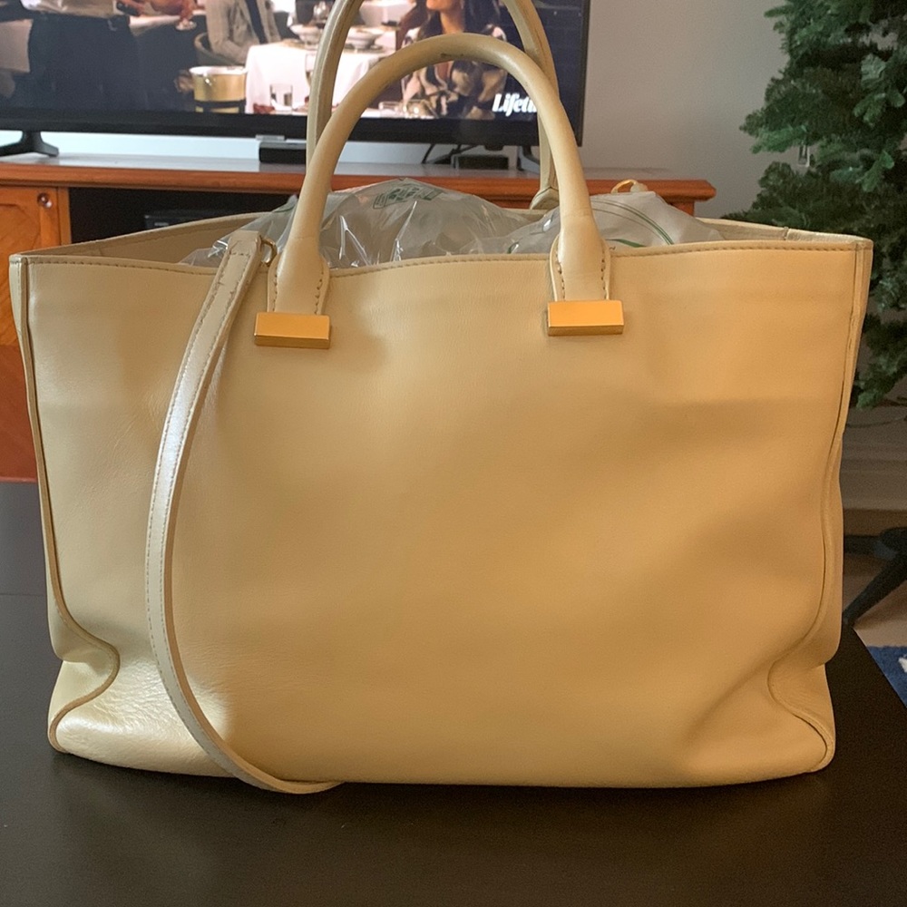 The Row classic cream-colored tote bag with gold hardware,  previously loved